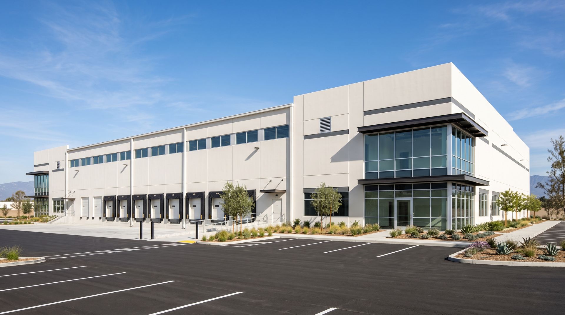 Photoreal render of the same industrial logistics building, with the dock doors, panel lines and glass office corner where the drawing placed them